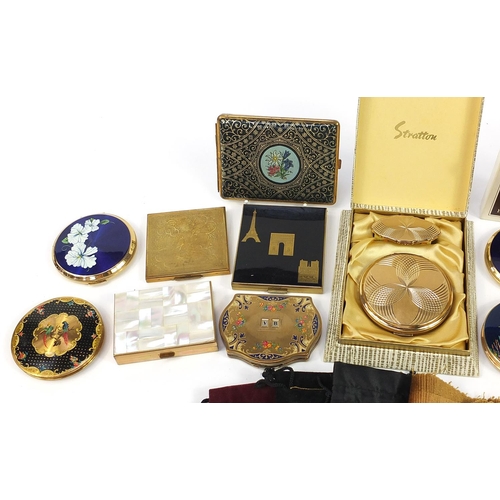 478 - Twelve vintage ladies powder compacts and a tooled leather cigarette case, some enamelled including ... 