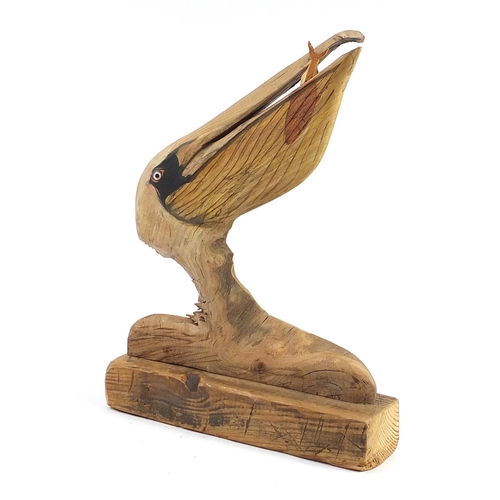 382 - Clive Fredriksson 2021, driftwood carving of a stylised pelican with fish, 61cm high