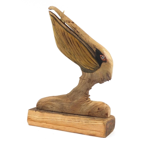 382 - Clive Fredriksson 2021, driftwood carving of a stylised pelican with fish, 61cm high