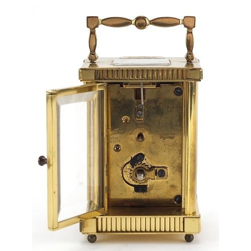 151 - St James brass cased carriage clock with enamelled dial having Roman numerals, 11.5cm high