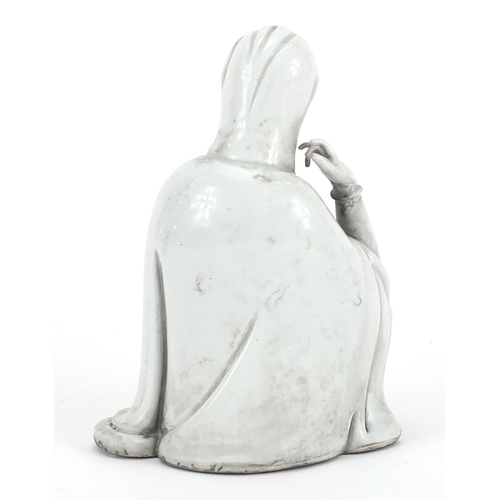 547 - Chinese porcelain figure of Guanyin having a blanc de chine glaze, 14cm high