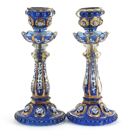 198 - Pair of Bohemian blue glass lustre candlesticks hand painted with flowers, 32cm high