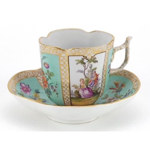 526 - Meissen, German porcelain cup with saucer hand painted with panels of figures and flowers, the sauce... 