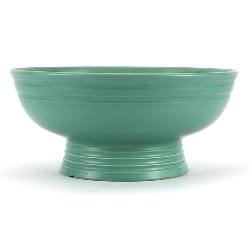 214 - Keith Murray for Wedgwood, green glazed footed bowl, 26cm in diameter