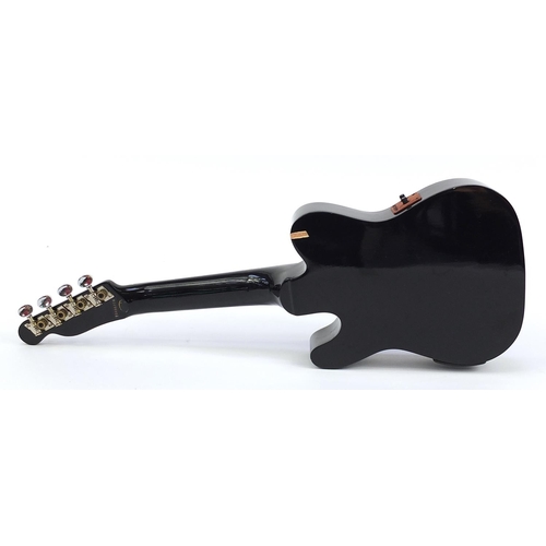 401A - Mahalo electric semi acoustic ukulele with case, label to the interior numbered FUTL1E/BK, 57cm in l... 