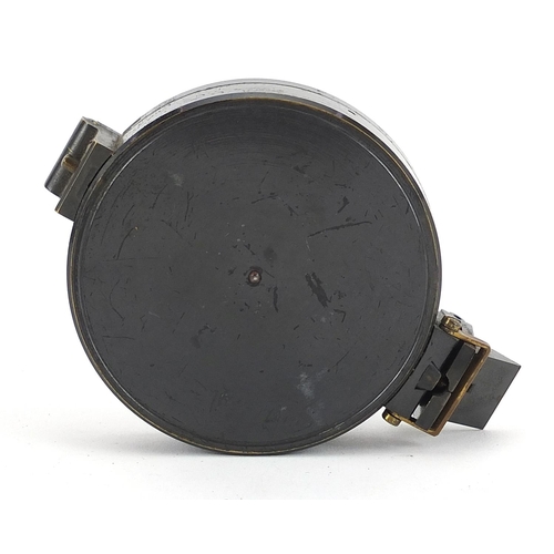 1379 - Military interest compass with brown leather case, 7cm in diameter