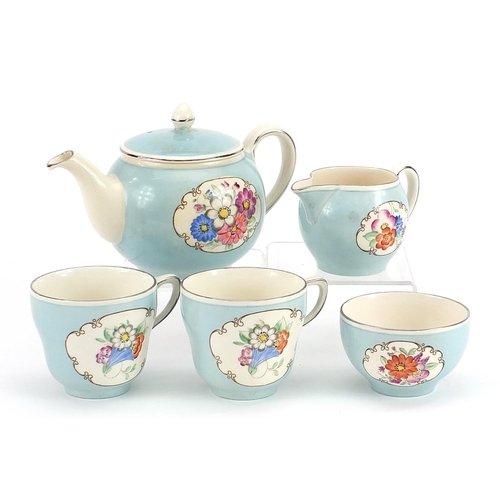 1015 - Gray's Pottery Pareek tea for two tea service hand painted with flowers, the teapot 19cm in length