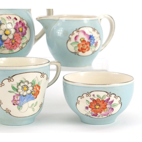 1015 - Gray's Pottery Pareek tea for two tea service hand painted with flowers, the teapot 19cm in length