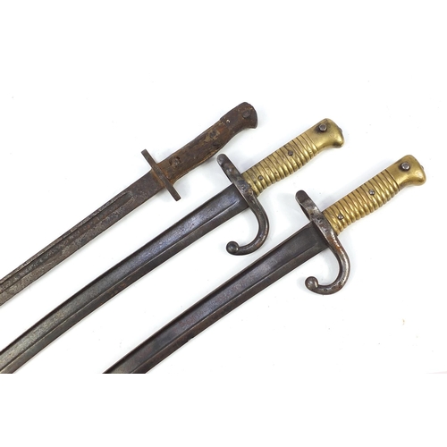 1396 - Three military interest long bayonets including two French examples