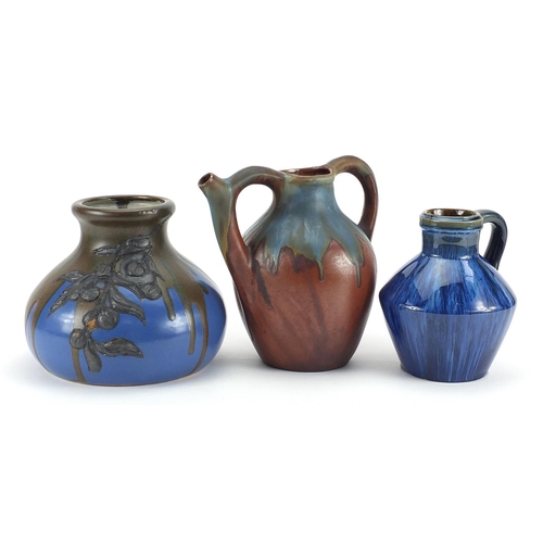 472 - Two Bourne Denby jugs including a spouted example and an Art Nouveau example with pewter overlay, th... 