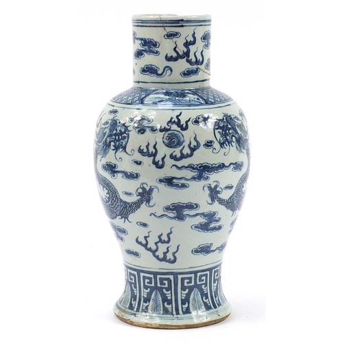 468 - Chinese blue and white porcelain baluster vase hand painted with dragons chasing a flaming pearl amo... 