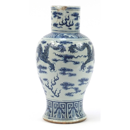 468 - Chinese blue and white porcelain baluster vase hand painted with dragons chasing a flaming pearl amo... 