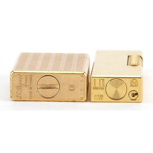 105 - Two gold plated engine turned pocket lighters comprising Dunhill and S J Dupont, the largest 6.5cm h... 