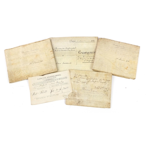 577 - Four antique vellum documents and a land tax register document