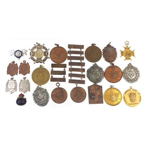 542 - Predominantly athletic jewels and medallions, some silver including standing high jump awarded to R ... 