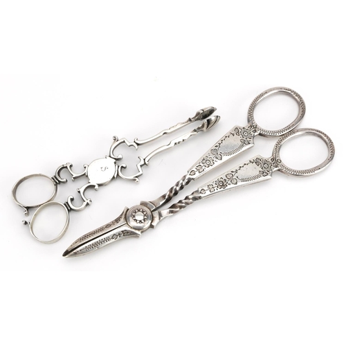 2131 - Henry Atkin, pair of silver grape scissors and a pair of silver sugar nips, indistinct hallmarks, th... 