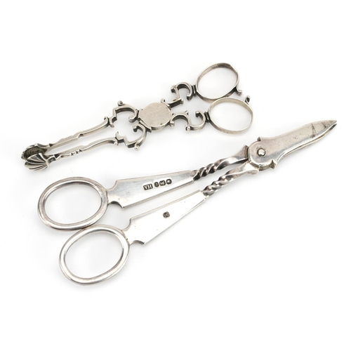 2131 - Henry Atkin, pair of silver grape scissors and a pair of silver sugar nips, indistinct hallmarks, th... 