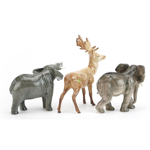 445 - Collectable china animals comprising Beswick elephant, Beswick stag and Goebel elephant, the largest... 