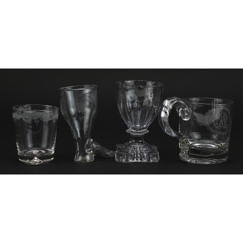 191 - Four 18th century glasses including a stirrup cup and handled cup with engraved initials, the larges... 