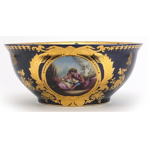 460 - Italian blue glazed porcelain centre bowl gilded with flowers, decorated with a panel of lovers, 36c... 