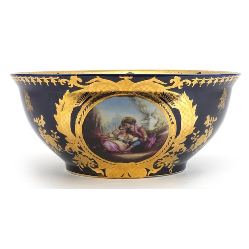 460 - Italian blue glazed porcelain centre bowl gilded with flowers, decorated with a panel of lovers, 36c... 