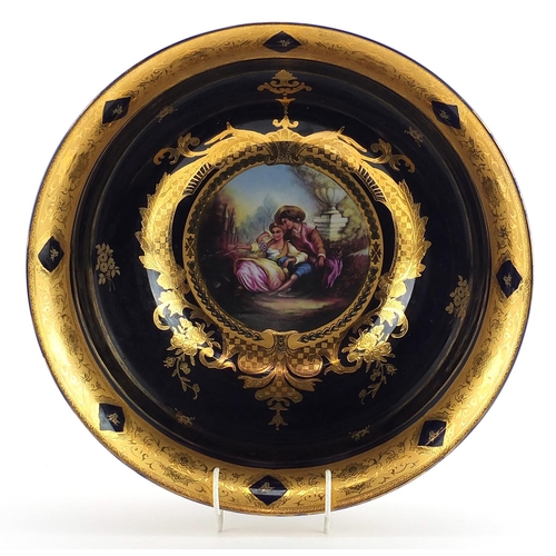 460 - Italian blue glazed porcelain centre bowl gilded with flowers, decorated with a panel of lovers, 36c... 