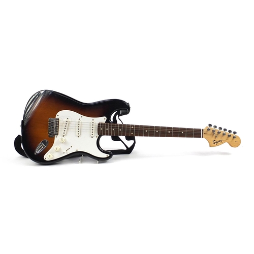 406 - 20th Anniversary Squire Strat by Fender electric guitar with a Ritter protective case, numbered CY02... 