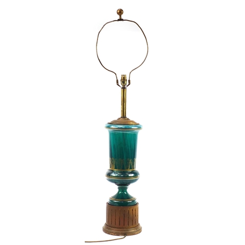 387 - Green glass table lamp with gilded decoration and column base, 107cm high