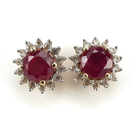 1409 - Pair of 9ct gold ruby and white sapphire stud earrings, 11mm in diameter, 2.8g