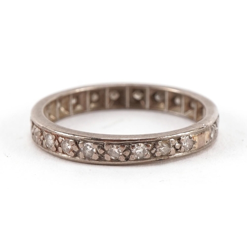 1410 - Unmarked white gold diamond eternity ring, tests as 18ct gold, housed in a Grant & Son Carlisle tool... 