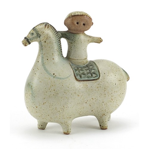 593 - Scandinavian design pottery model of a boy on stylised horse, 14cm in length