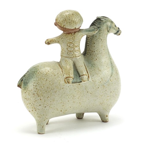 593 - Scandinavian design pottery model of a boy on stylised horse, 14cm in length