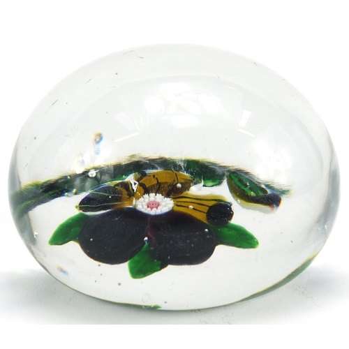 40 - 19th century Baccarat floral glass paperweight with paper label inscribed 199 to the base, approxima... 