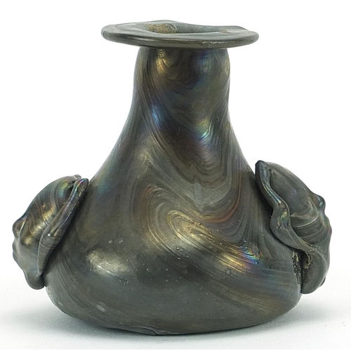 86 - Roman iridescent glass vase with figural handles, 7.5cm high