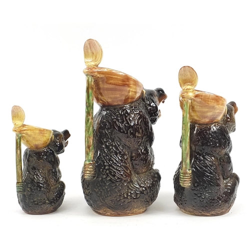 291 - Graduated set of three Majolica style brown bear jugs, the largest 33cm high