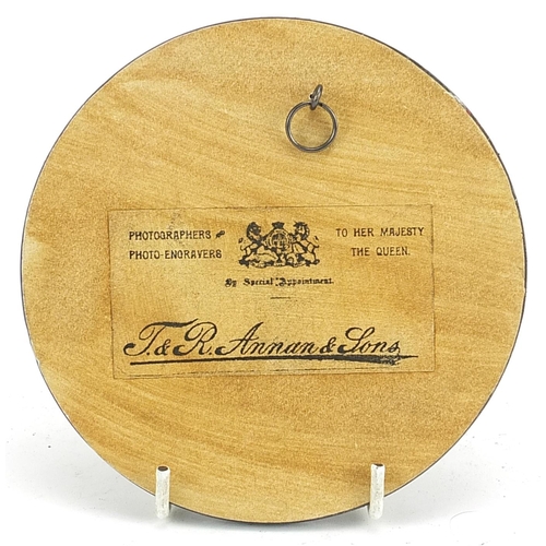 587 - Military interest bronzed plaque with ebonised frame, 13cm in diameter