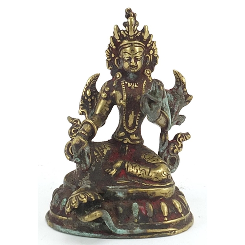 555 - Tibetan patinated bronze figure of Buddha, 12cm high