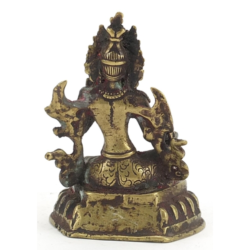 555 - Tibetan patinated bronze figure of Buddha, 12cm high