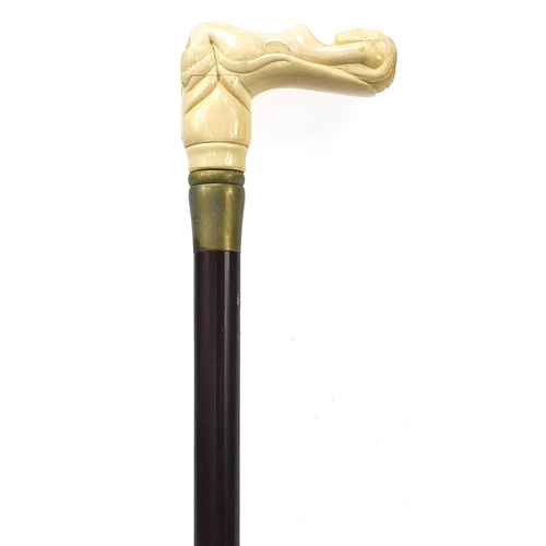 1018 - Hardwood walking stick with carved bone nude female handle, 87cm in length