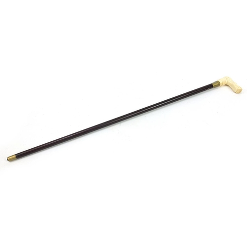 1018 - Hardwood walking stick with carved bone nude female handle, 87cm in length