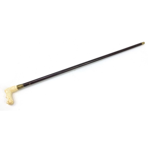 1018 - Hardwood walking stick with carved bone nude female handle, 87cm in length