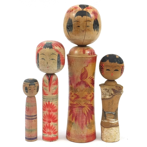 858 - Four Japanese Kokeshi dolls, the largest 40cm high