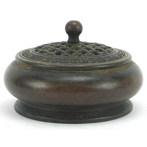 552 - Chinese patinated bronze censer with pierced cover, 9.5cm in diameter