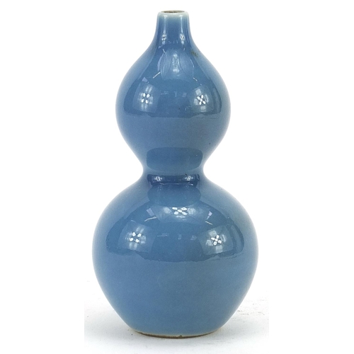 598 - Chinese porcelain double gourd vase having a blue glaze, character marks to the base, 11cm high