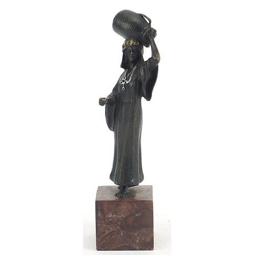 606 - Cold painted bronze figurine of an African water carrier in the style of Franz Xaver Bergmann, raise... 