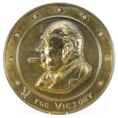 1386 - Military interest bronzed circular plaque embossed with a portrait of Churchill and motto, 36cm in d... 