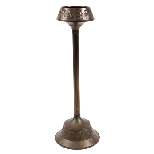 386 - Art Nouveau Daalderop bronzed smoker's stand embossed with stylised motifs, 71cm high