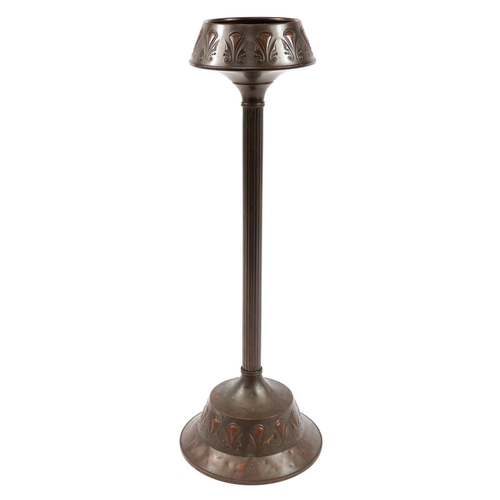 386 - Art Nouveau Daalderop bronzed smoker's stand embossed with stylised motifs, 71cm high