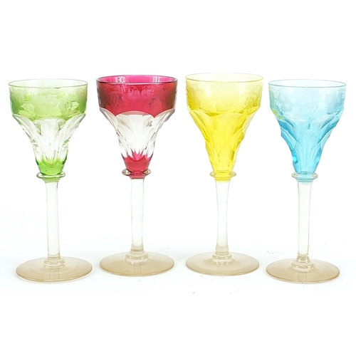 623 - Set of four Bohemian flashed cut glasses etched with leaves and berries, each 15cm high