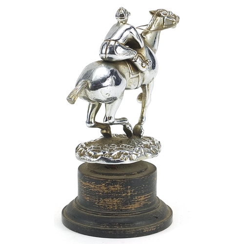 159 - Desmo, vintage chrome plated car mascot in the form of a jockey on horseback raised on later ebonise... 